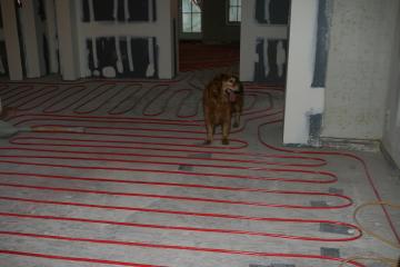 [Radiant heat tubes on first floor before slab poured]